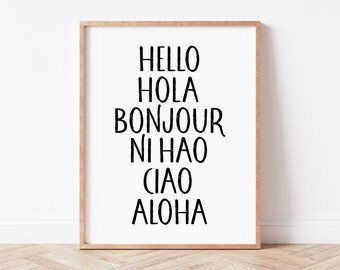 May include: Black and white printable wall art with the words "Hello", "Hola", "Bonjour", "Ni Hao", "Ciao", and "Aloha" in a handwritten font.