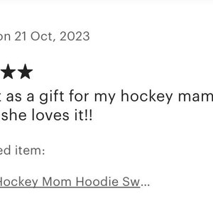 May include: Five star review for a black hoodie with the text "Hockey Mom" and a hockey stick graphic. The review says "Bought as a gift for my hockey mama friend, she loves it!!"