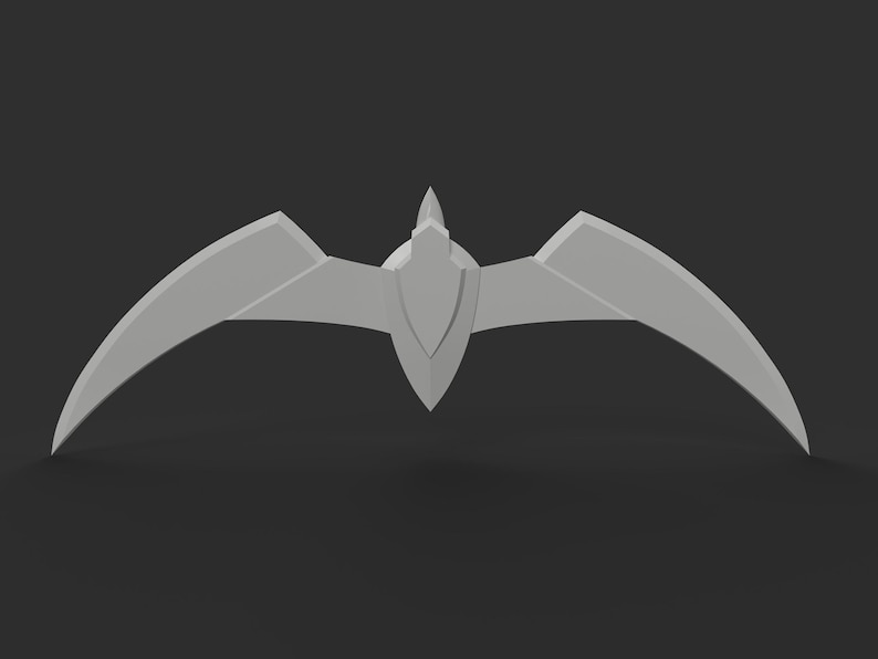 May include: A light gray, stylized bat-shaped emblem with a central shield-like element and curved, wing-like extensions. The emblem is set against a dark gray background, creating a contrast that highlights its geometric design.