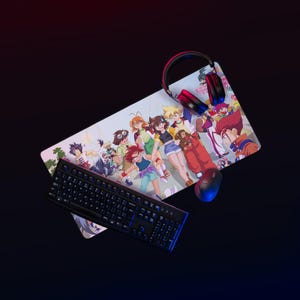 May include: A gaming setup featuring a black keyboard with blue backlighting, a mouse, and a headset. The setup includes a large mousepad with a colorful anime-style illustration of several characters. The background is dark.