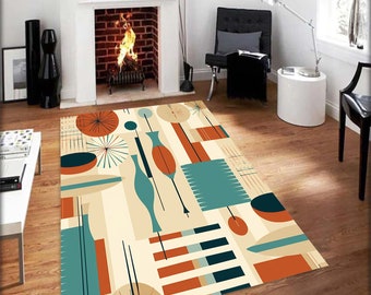 May include: Abstract geometric rug with a cream background, featuring teal, orange, and brown shapes. The rug has a mid-century modern design.