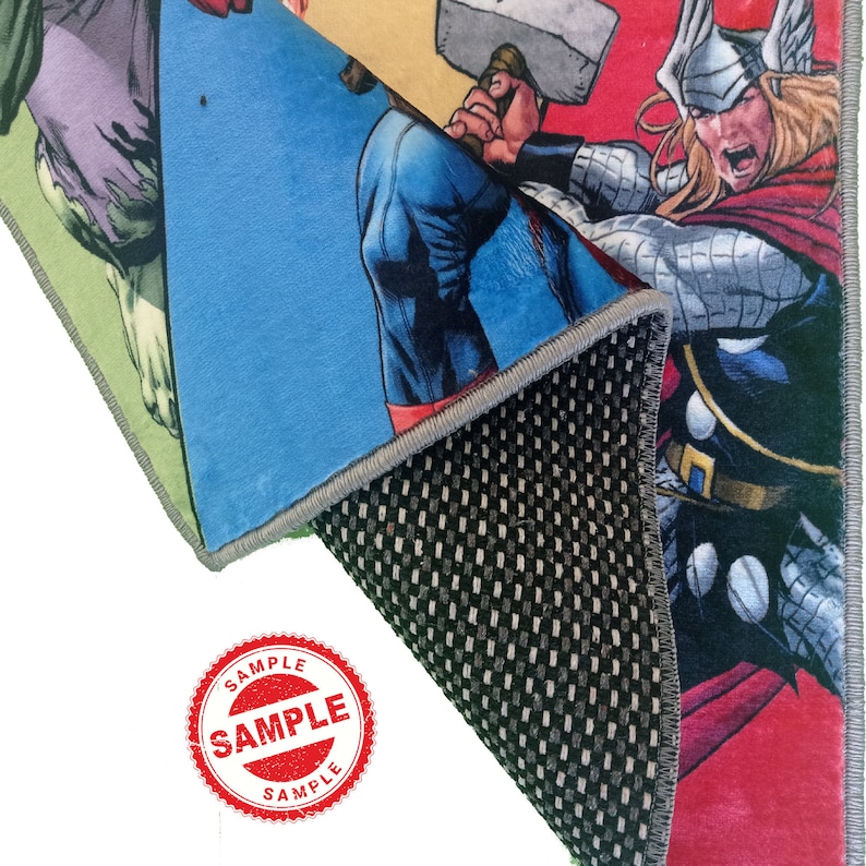May include: A colorful rug featuring a superhero theme with characters like Captain America, Thor, and Hulk. The rug has a non-slip backing and is labeled "SAMPLE".