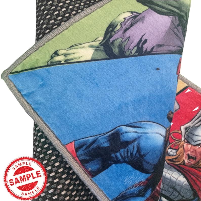 May include: A colorful rug featuring a comic book style design with characters from the Avengers. The rug has a blue, green, red, and black color scheme. The characters include Captain America, Thor, and the Hulk.