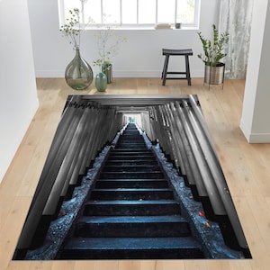 May include: A black and white photo of a long staircase leading up to a bright light at the end of a tunnel of pillars. The staircase is made of stone and the pillars are made of wood.