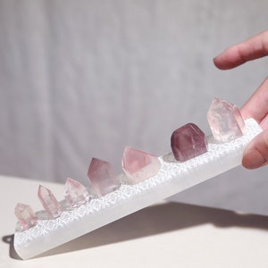 Pink lithium points set of 7 with selenite cleansing bar pink and purple phantom quartz