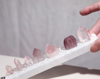 Pink lithium points set of 7 with selenite cleansing bar pink and purple phantom quartz