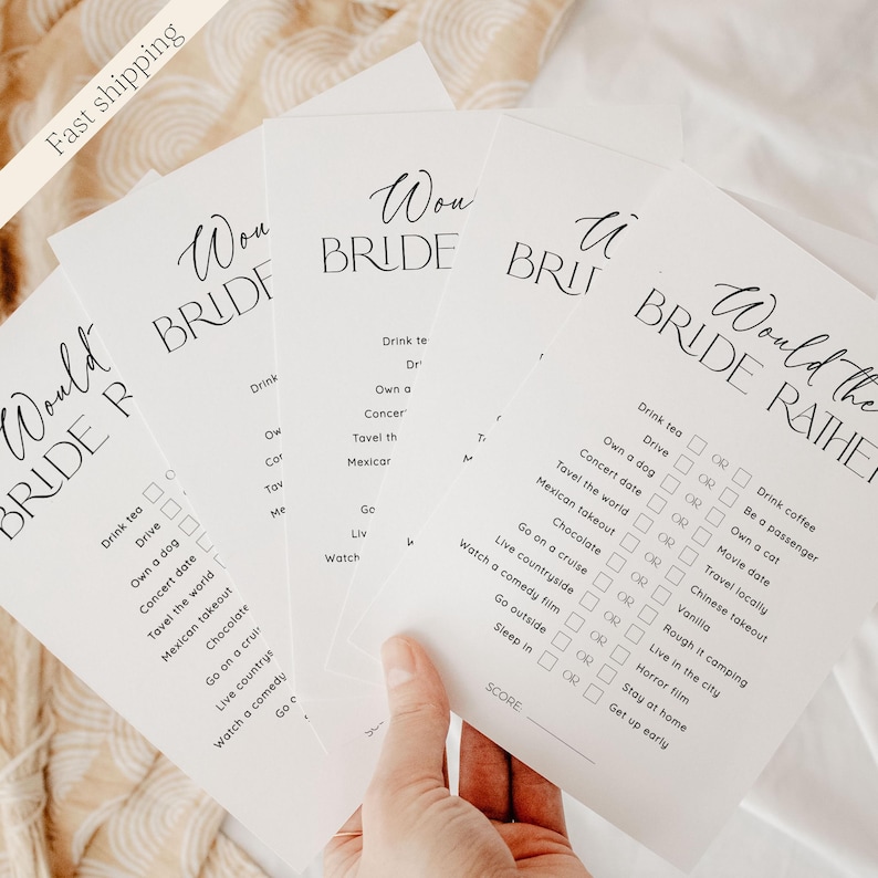 May include: A set of four white cards with black text. Each card has the words "Would You Rather" and a list of questions. The questions are about different activities and preferences. For example, one question is "Drink tea or drink coffee?"