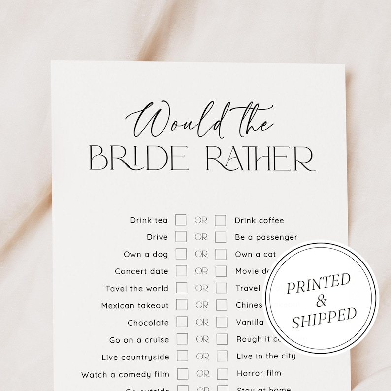 May include: A printable "Would the Bride Rather" game with a list of questions and checkboxes for the bride to choose between two options. The game is printed on white paper with black text and checkboxes. The game is framed by a black border. The game is printed and shipped.