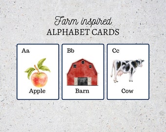 May include: Farm inspired alphabet cards featuring a red apple, a red barn, and a black and white cow. The letters Aa, Bb, and Cc are displayed on the cards.