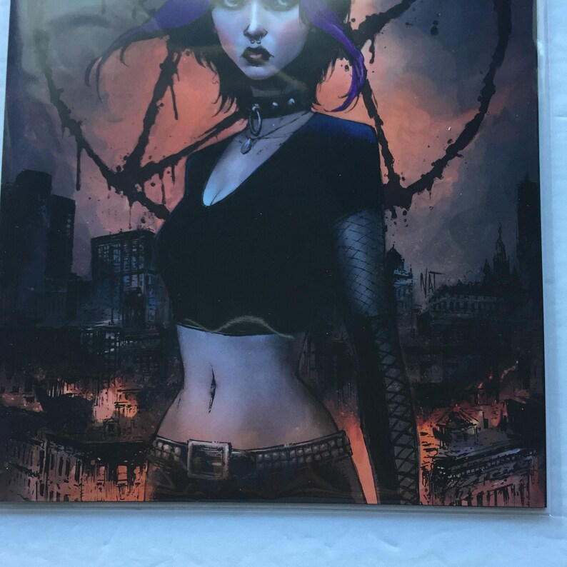 May include: Comic book cover art featuring a woman with purple hair, wearing a black top and choker. A pentagram is drawn in the background, with a cityscape in the distance. The artwork has a dark, gothic theme.
