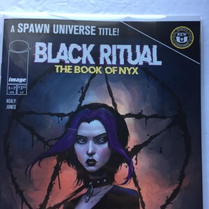 May include: Comic book cover for "Black Ritual: The Book of Nyx." The cover features a woman with purple hair and dark makeup against a dark, ominous background. The title and other text are prominently displayed.