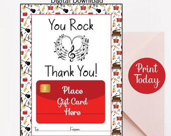May include: Printable gift card template with a musical theme. The template features a red heart with musical notes, the text "You Rock Thank You!" and a red rectangle for a gift card. The border of the template is decorated with musical instruments.