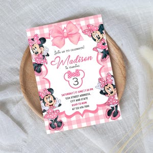 May include: Pink and white gingham birthday invitation with a cartoon mouse character. The invitation says "Join us to celebrate! Madison is turning 3. Saturday 17 June | 7:30 PM 1234 Street Address, City and State RSVP to Mom at 123 456 7890"