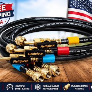 May include: A coiled black Fieldpiece premium refrigerant barrier hose featuring brass fittings, integrated ball valves with black handles, and color-coded yellow, red, and blue connectors, rated for 4000 PSI burst pressure for HVAC systems.
