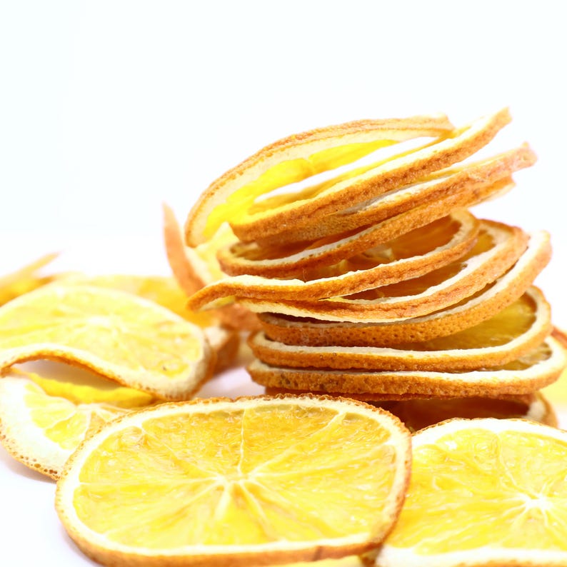 Handcrafted dried citrus slices offering vibrant texture and delicious orange flavor. Perfect for use as cocktail garnish, cake decoration, or to infuse teas and drinks. These natural orange dried slices are consistent in size, approx. 4.5–6 cm, and made from dry oranges without additives. A healthy dry fruit option, vegan and vegetarian friendly, for both décor and taste.