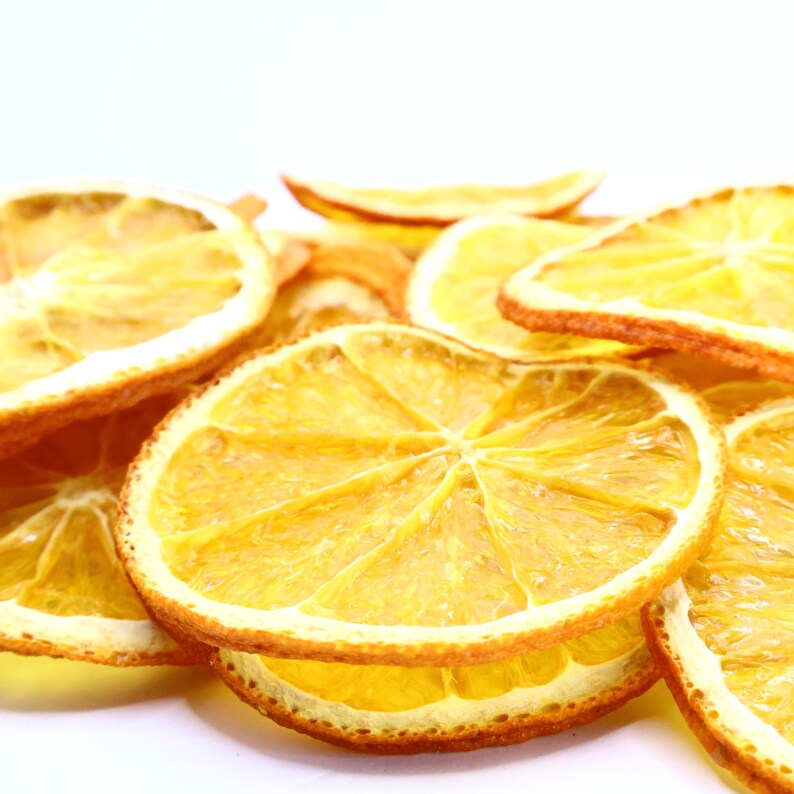 Collection of artisan dried orange slices crafted for use as cocktail garnish, dessert topper, or natural dry fruit snack. These dried citrus slices have been evenly dried to approx. 3 mm for consistent texture. Made from the best dry oranges, they offer authentic citrus flavor and appealing visual style. Vegan and vegetarian friendly, perfect for food, drinks, and décor.