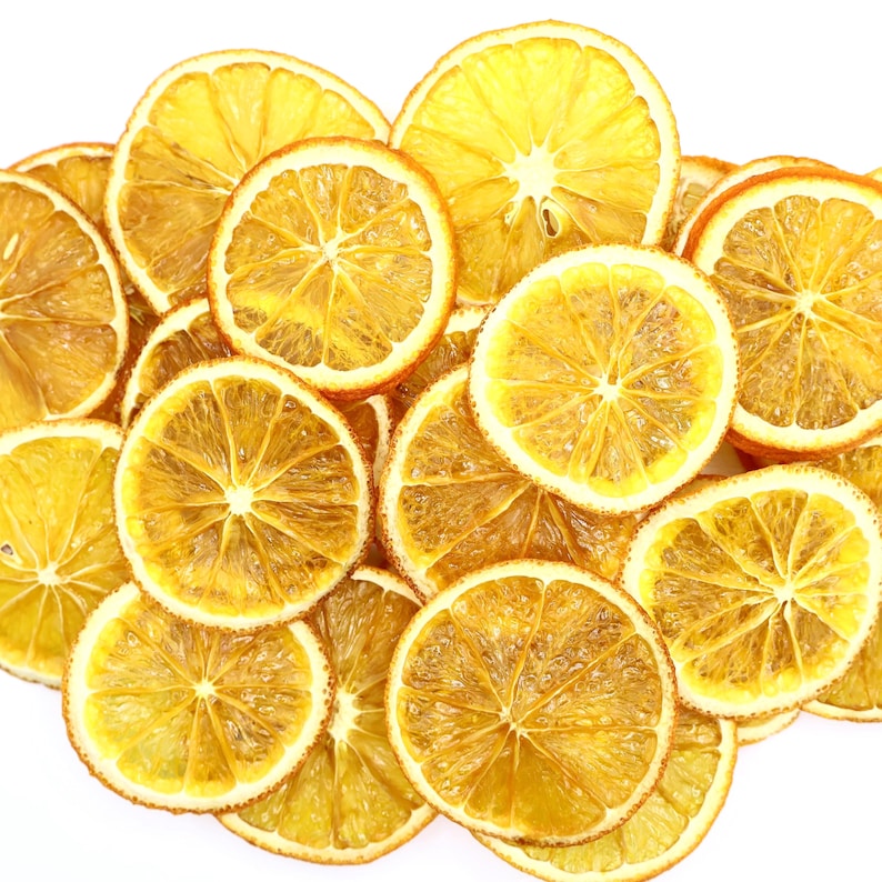 Beautifully arranged dried orange slices made from high-quality dried natural fruits, perfect for use as cocktail garnish, dessert topping, or tea decoration. These dried citrus slices bring vibrant orange color and natural citrus aroma, making them ideal for food styling, drinks, and DIY décor. A healthy and tasty dry fruit option that is both vegan and vegetarian friendly.