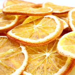 Pack of natural dried orange slices made with premium dried natural fruits for culinary and decorative use. These versatile dried citrus slices are a must-have for cocktails, teas, desserts, or even festive décor. Every orange dried slice is prepared with care, offering authentic citrus aroma and flavor. A healthy dry fruit snack that is vegan, vegetarian, and eco-friendly for everyday use.