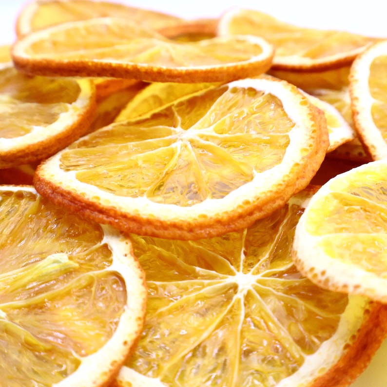 Pack of natural dried orange slices made with premium dried natural fruits for culinary and decorative use. These versatile dried citrus slices are a must-have for cocktails, teas, desserts, or even festive décor. Every orange dried slice is prepared with care, offering authentic citrus aroma and flavor. A healthy dry fruit snack that is vegan, vegetarian, and eco-friendly for everyday use.