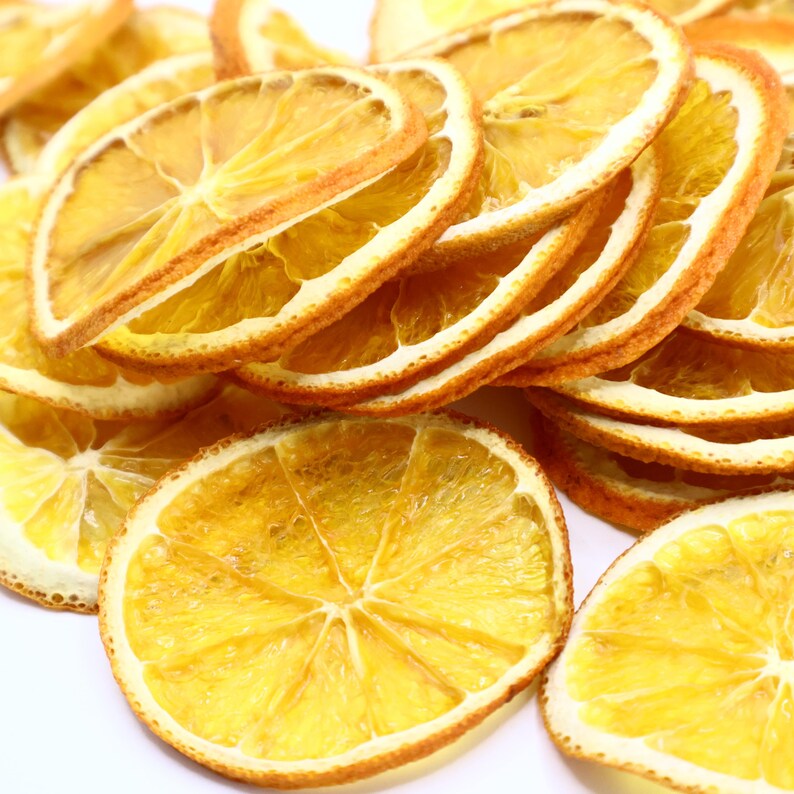 Set of dried orange slices showcasing their rich color and authentic citrus aroma. Each orange slice is dried to approx. 3 mm, making them ideal for cocktails, baking, teas, and elegant food decoration. These dried citrus slices are vegan, vegetarian, and made only from dried natural fruits, providing a perfect balance between dry fruit snack and stylish drink garnish.