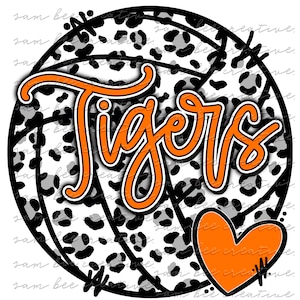 May include: A black and white volleyball with a leopard print design. The word "Tigers" is written in orange across the volleyball. A large orange heart is in the lower right corner of the image.