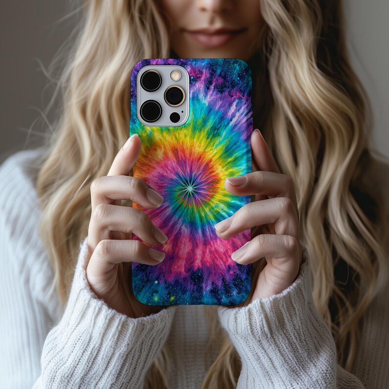 May include: A colorful phone case featuring a vibrant tie-dye spiral design in shades of blue, purple, pink, yellow, and green. The case has a glossy finish and a protective bumper. The phone case is designed to fit a smartphone.