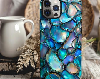 May include: A blue and green iridescent phone case with a pattern of overlapping circles. The case is designed to fit a smartphone with a camera bump.