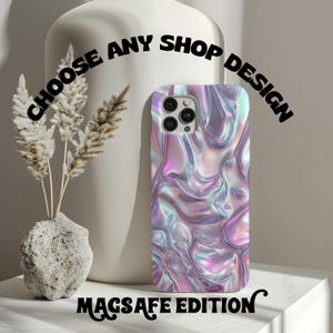 May include: A phone case with a iridescent, pearlescent, and holographic design. The case is compatible with MagSafe. The text "Choose Any Shop Design" is written in black on a white background above the case. The text "MagSafe Edition" is written in black on a white background below the case.