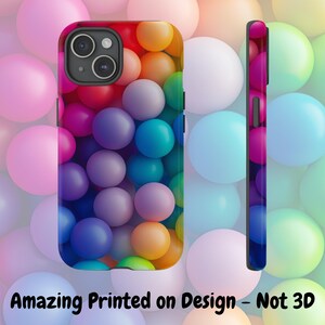May include: A phone case with a colorful design of many round balls in shades of blue, green, red, orange, yellow, and purple. The case is made for a smartphone with a camera lens cutout.