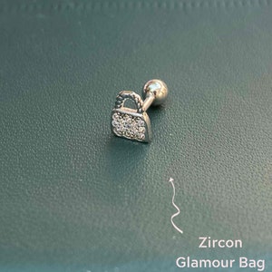 Elevate your style with this elegant ear piercing, Gift a Zircon-studded bag shape, perfect for adding a touch of glamour to any look.