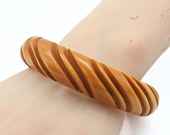 Astonishing Heavy Carved Golden Yellow Butterscotch Laminated Bakelite Bangle Bracelet