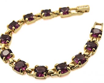 Pulsera de eslabones dorados con cristales Swarovski morados de gran belleza