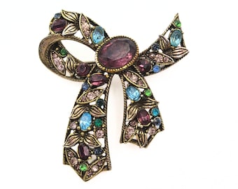 Vintage Hollycraft Signed Bow Brooch Multi Color Rhinestone Pastel Purple Glass Ribbon Pin Antique Gold Tone Ornate Victorian Style Jewelry