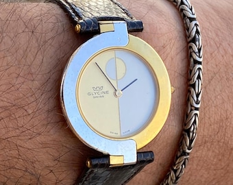 Zwitsers vintage glycine-horloge | Verguld, saffierkristal, Cartier Vendôme-stijl