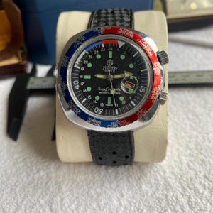 Reloj vintage Mortima Compressor GMT con hora mundial, cuerda manual suiza, década de 1970