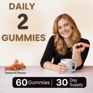 May include: Image of a woman holding two dark brown gummies and a white mug. Text reads "DAILY 2 GUMMIES" and "Tamarind Flavour". A black banner states "60 Gummies | 30 Day Supply".