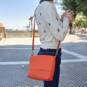 orange leather crossbody bag perfect for more daring people