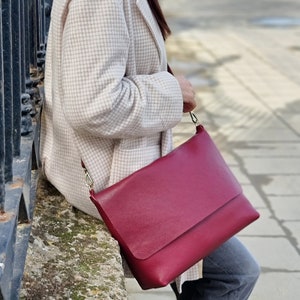 our leather crossbody bag in size L and burgundy color