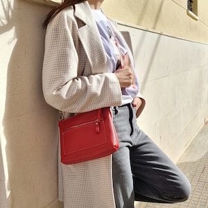 Red leather crossbody bag available in different colors, this crossbody bag has a outside pocket