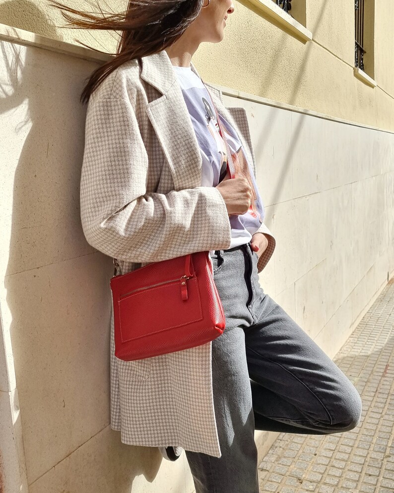 Red leather crossbody bag available in different colors, this crossbody bag has a outside pocket