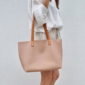 light pink leather tote bag very stylish