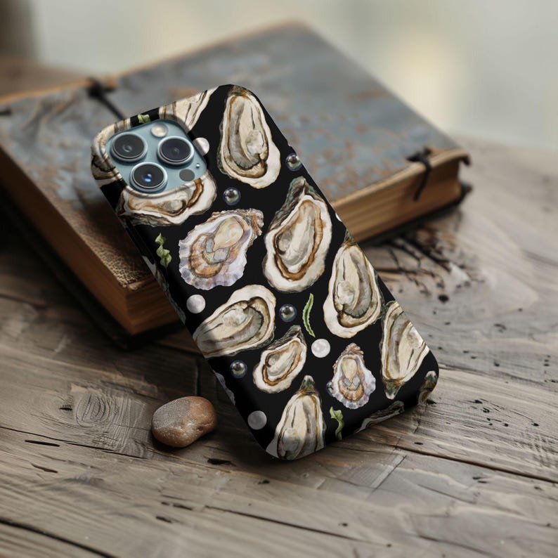 May include: Black phone case with a watercolor design of oysters and pearls.