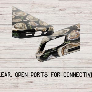 May include: Two phone cases with a black background and a pattern of oyster shells. The cases have open ports for connectivity.