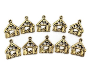 May include: Ten gold-toned metal charms featuring a nativity scene with a star on top. The charms are perfect for adding a festive touch to crafts, jewelry, and other projects.