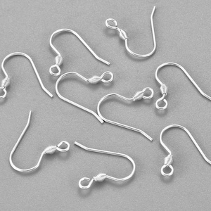 May include: A set of eight silver earring hooks, each with a small loop at the top and a curved wire hook. The hooks are designed for attaching earrings.