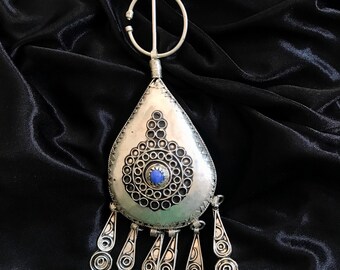 A unique traditional Moroccan brooch, taddart,Greater Kabylie region of Marrakesh, Morocco, was a symbol of the perfect and beautiful woman.