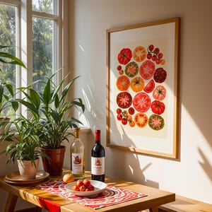 May include: A framed wall print featuring a colorful illustration of various sliced and whole tomatoes in shades of red, orange, yellow, and green, displayed on a light-colored wall above a wooden table with wine bottles and plants.