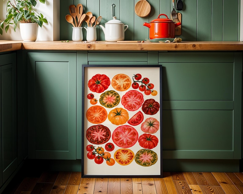 May include: A framed rectangular wall art print featuring a collection of various heirloom tomatoes in shades of red, orange, yellow, green, and purple. The illustration displays both whole tomatoes and cross-section slices arranged on a cream background.
