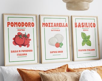 May include: Three framed prints with illustrations of Italian food ingredients. The first print features red tomatoes with the text "Pomodoro Napoli Salsa di Pomodoro Italiana". The second print features white mozzarella balls with the text "Mozzarella Battipaglia Sapore Unico". The third print features green basil leaves with the text "Basilico Genova Profumo Italiano".