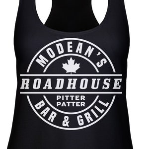 May include: Black tank top with a white circle logo that says "Modean's Roadhouse Bar & Grill" with a maple leaf and the words "Pitter Patter" inside the circle.